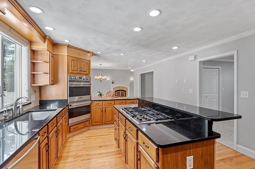 83 Weldon Farm Road Rowley, MA 01969 - Photo 11 of 41 a kitchen with stainless steel appliances granite countertop a stove and a sink