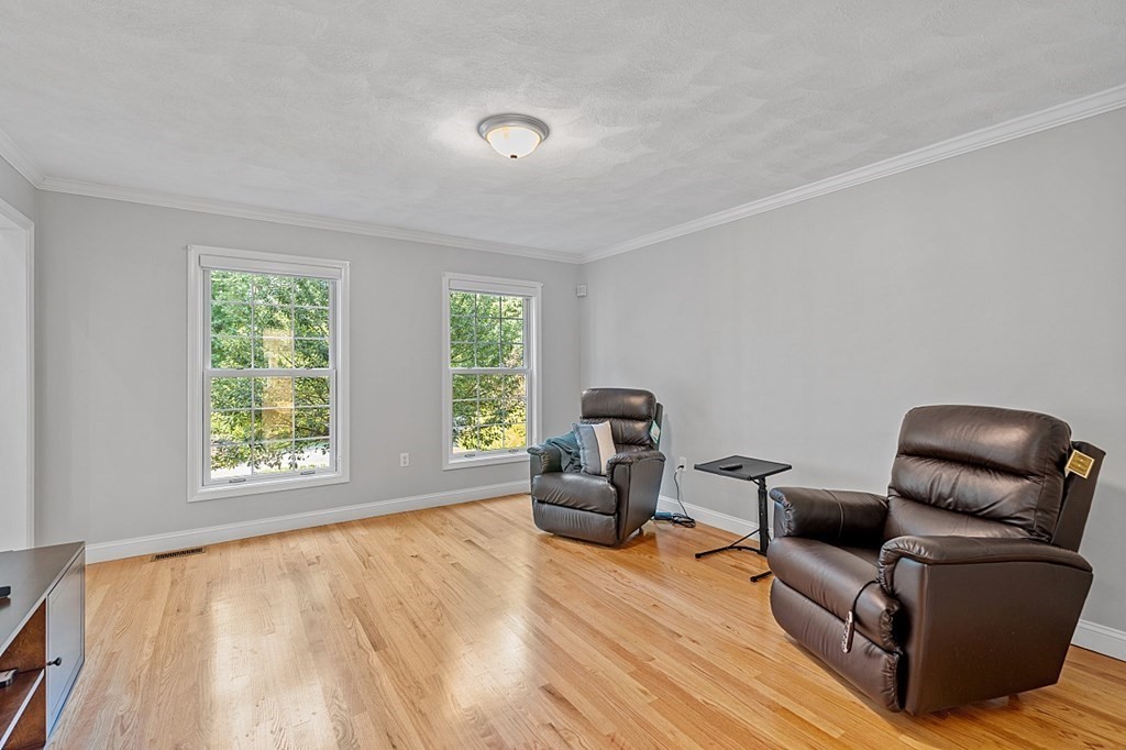 83 Weldon Farm Road Rowley, MA 01969 - Photo 15 of 41 a living room with furniture and a window