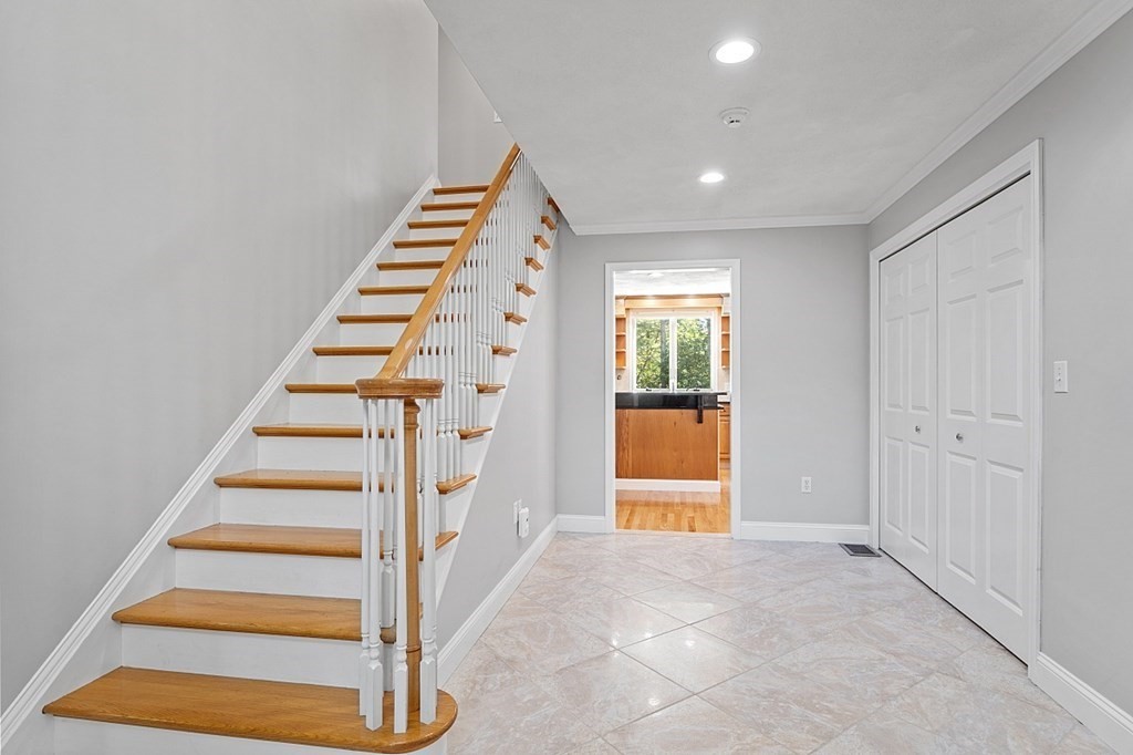 83 Weldon Farm Road Rowley, MA 01969 - Photo 2 of 41 a view of entryway with wooden floor and stairs