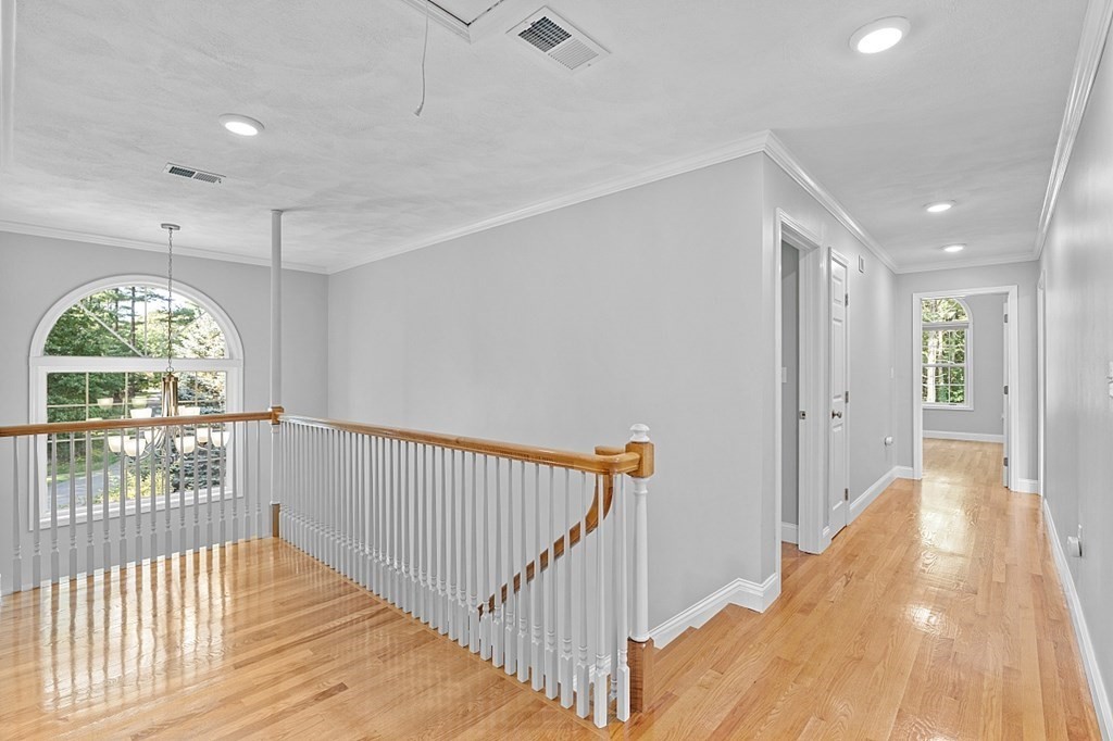 83 Weldon Farm Road Rowley, MA 01969 - Photo 21 of 41 a view of a hallway with wooden floor