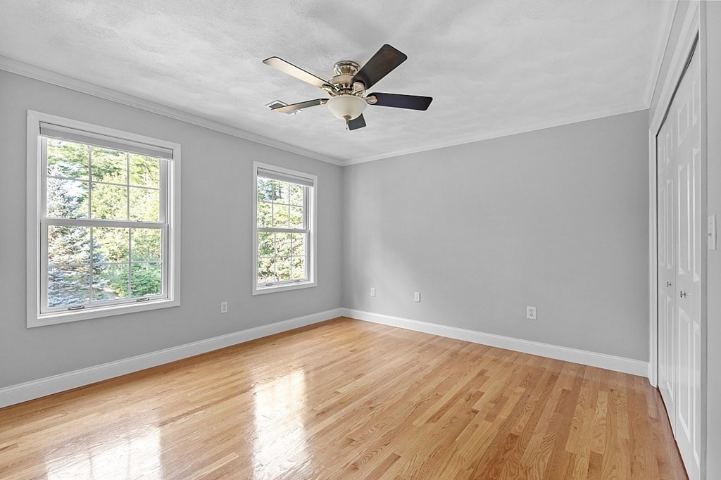 83 Weldon Farm Road Rowley, MA 01969 - Photo 23 of 41 a view of an empty room with wooden floor and a window