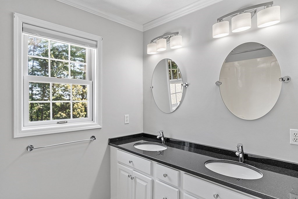 83 Weldon Farm Road Rowley, MA 01969 - Photo 24 of 41 a bathroom with 2 sink and a mirror