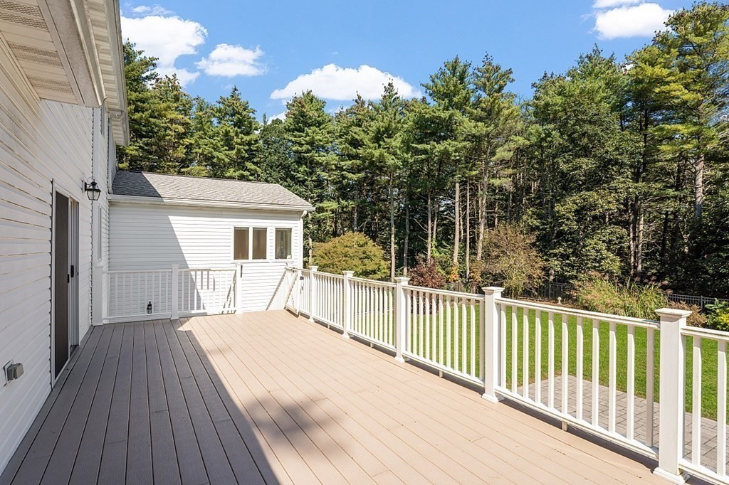 83 Weldon Farm Road Rowley, MA 01969 - Photo 33 of 41 a view of a house with a wooden deck