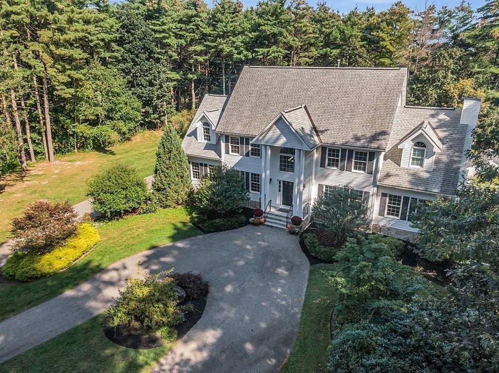 83 Weldon Farm Road Rowley, MA 01969 - Photo 40 of 41 an aerial view of a house with a yard and green space