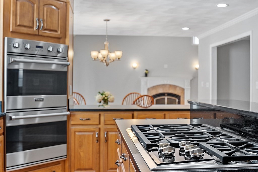 83 Weldon Farm Road Rowley, MA 01969 - Photo 8 of 41 a stove top oven sitting inside of a kitchen
