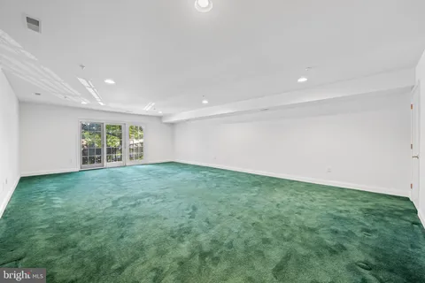 a view of a big room with windows