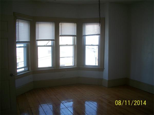 527 Division Street Fall River, MA 02721 - Photo 16 of 30 an empty room with a window