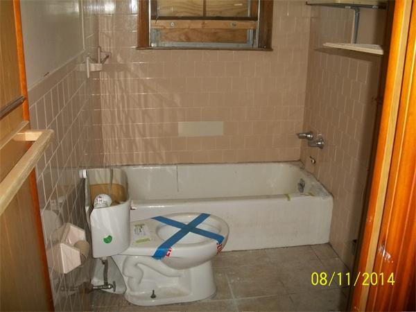 527 Division Street Fall River, MA 02721 - Photo 17 of 30 a bathroom with a bathtub