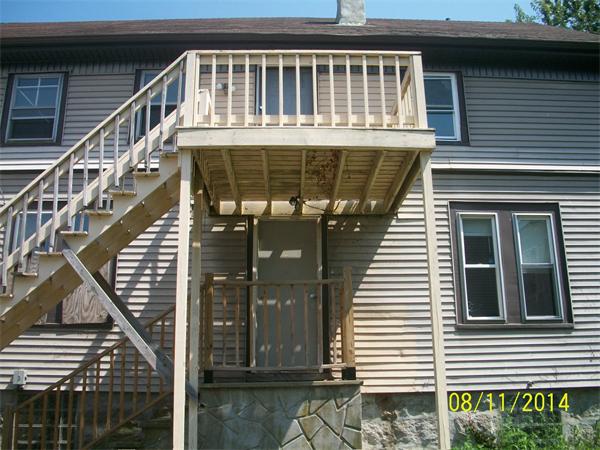 527 Division Street Fall River, MA 02721 - Photo 20 of 30 a front view of a house with a balcony