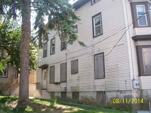 527 Division Street Fall River, MA 02721 - Photo 2 of 30 a front view of a house with garden
