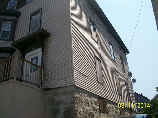 527 Division Street Fall River, MA 02721 - Photo 3 of 30 a view of a house with a street