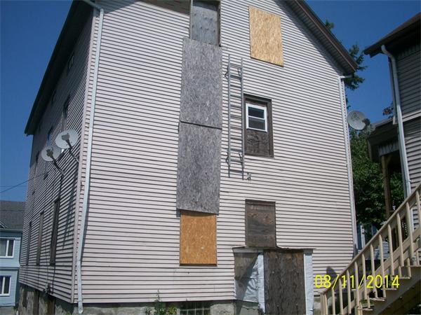 527 Division Street Fall River, MA 02721 - Photo 4 of 30 a view of a white house with many windows