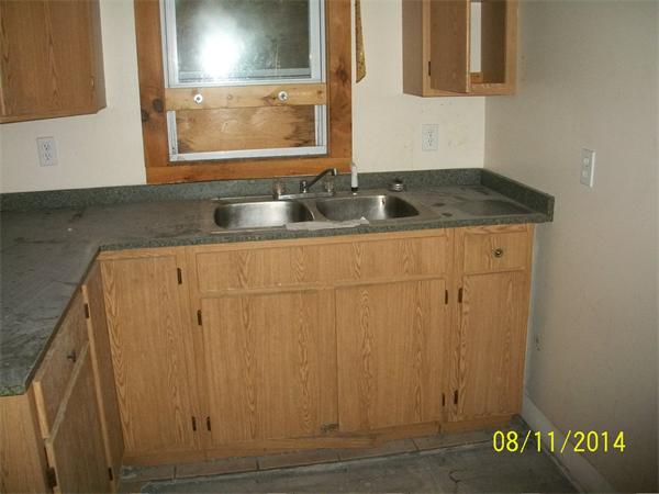 527 Division Street Fall River, MA 02721 - Photo 6 of 30 a bathroom with a sink and a mirror