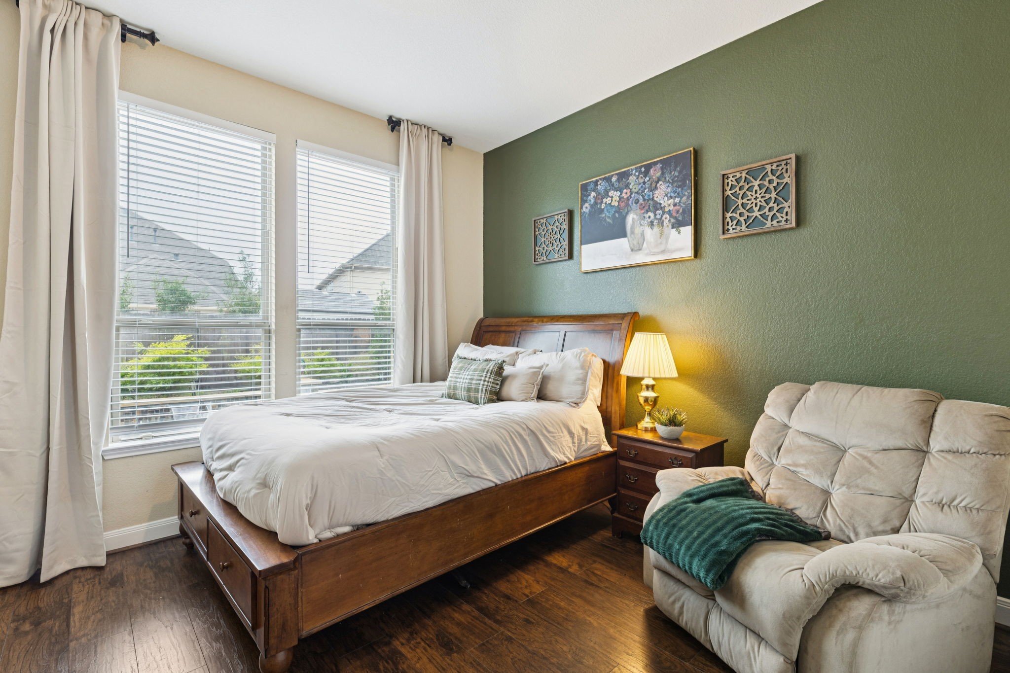 1118 Fragile Sail Court Katy, TX 77494 - Photo 17 of 35 This downstairs secondary bedroom features warm wood look laminate flooring, large windows and functions perfect as a comfortable guest retreat, cozy reading room or an additional home office.