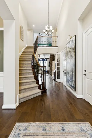 a view of entryway and hall with wooden floor