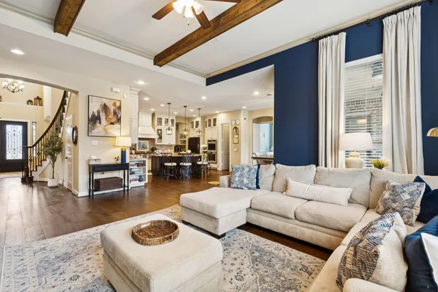 a living room with furniture and a table