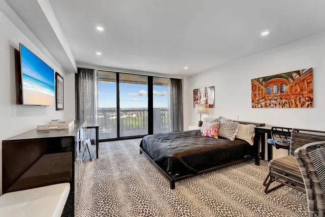 a bedroom with a bed and a couch