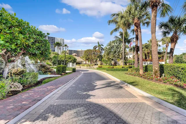 a view of a street with a building in the background