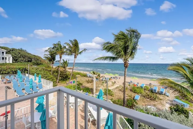 a view of a street with a building in the background