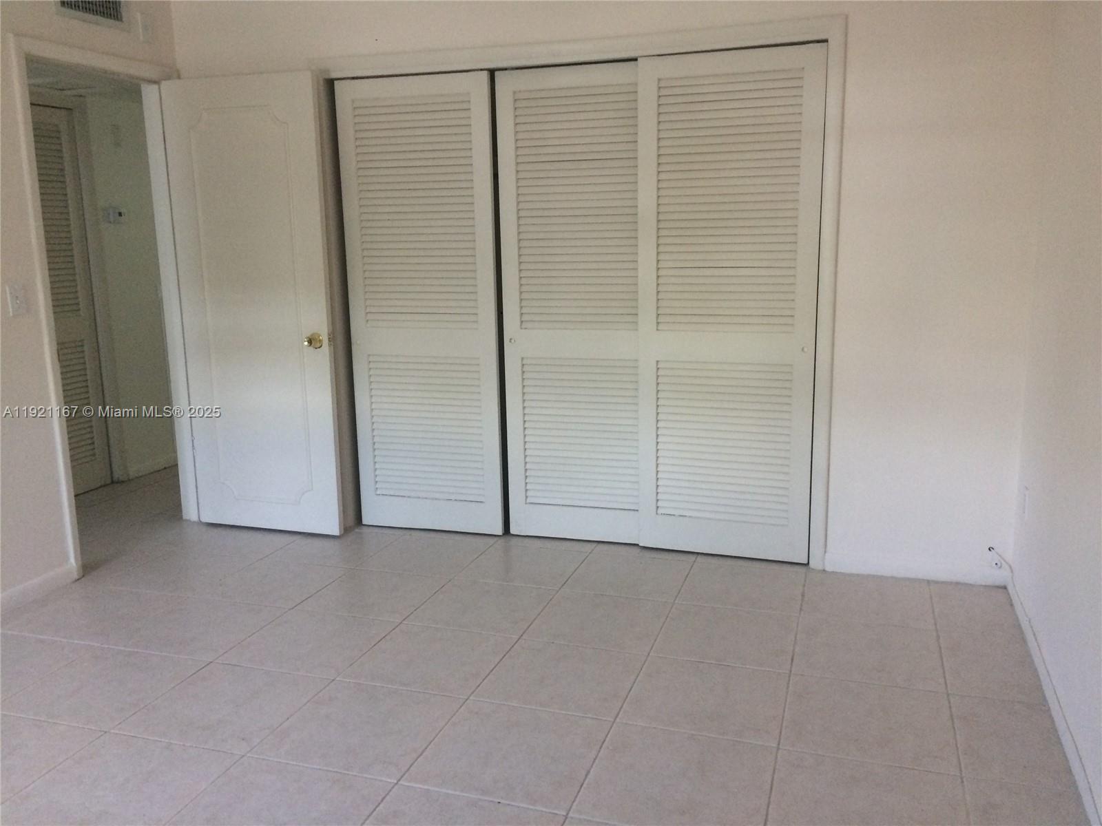 255 Sunrise Drive, Unit 103 Key Biscayne, FL 33149 - Photo 7 of 11 a view of an empty room