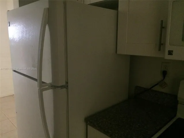 a kitchen that has a sink and cabinets