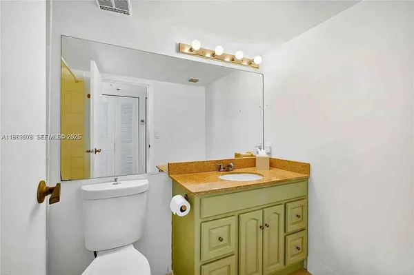 a bathroom with a shower a toilet and a shower