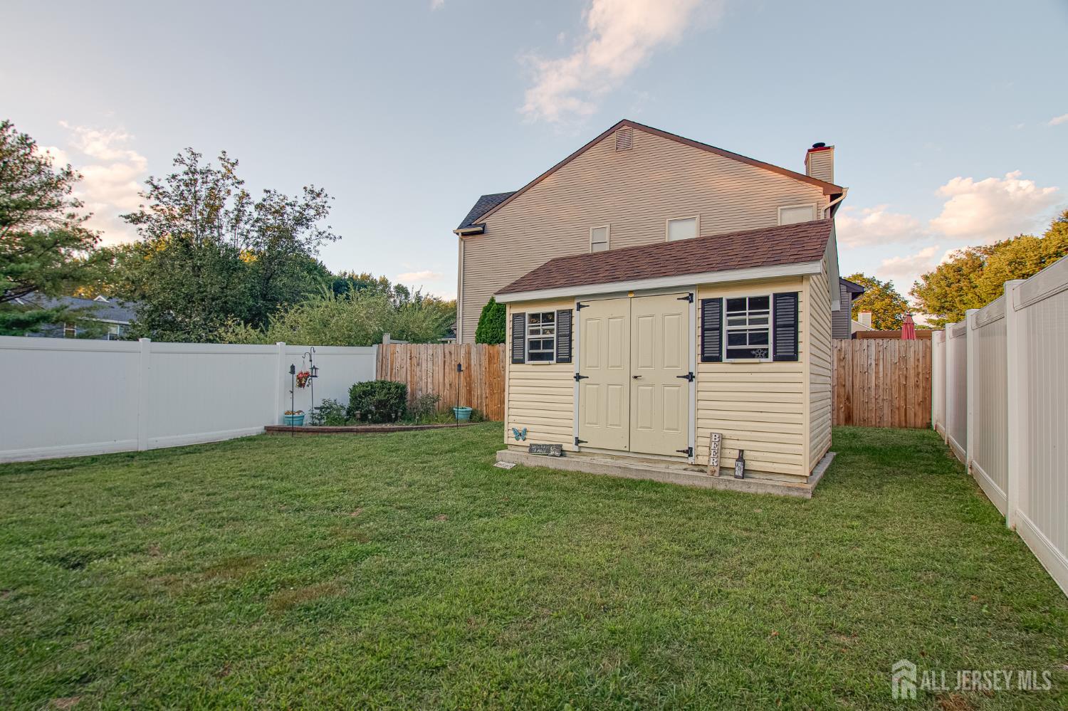 2 Fieldcrest Way Freehold, NJ 07728 - Photo 22 of 24 a view of a house with backyard