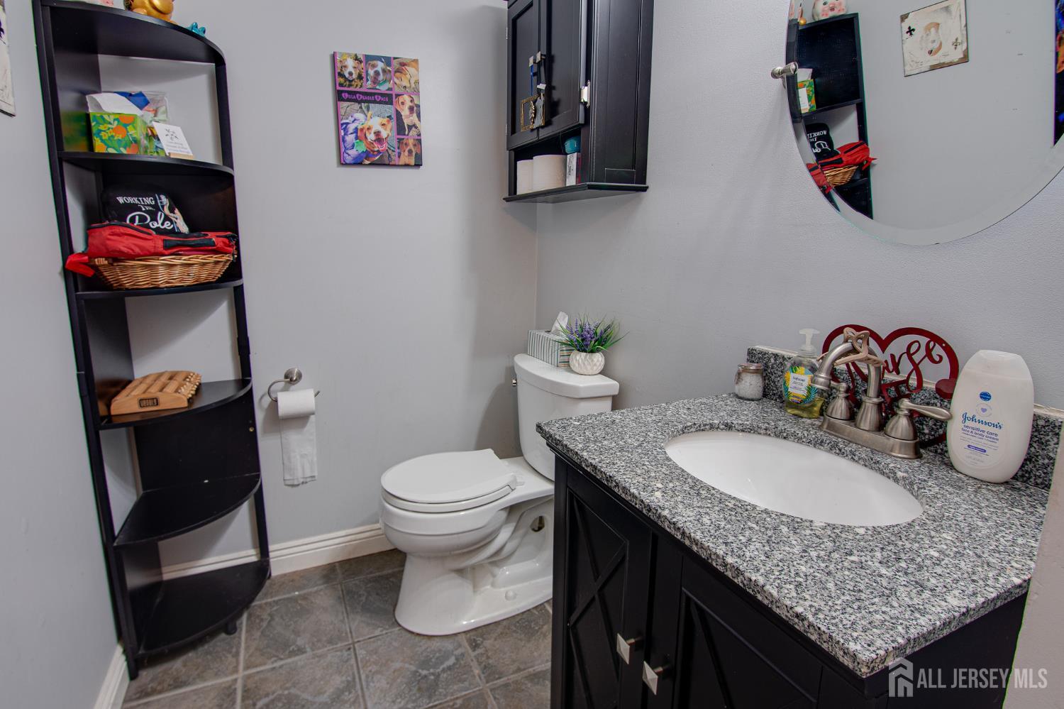 2 Fieldcrest Way Freehold, NJ 07728 - Photo 10 of 24 a bathroom with a granite countertop sink and a mirror