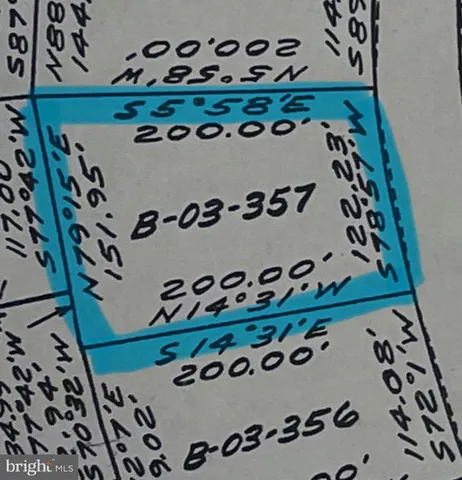 view of a room that has a plant and a sign in it