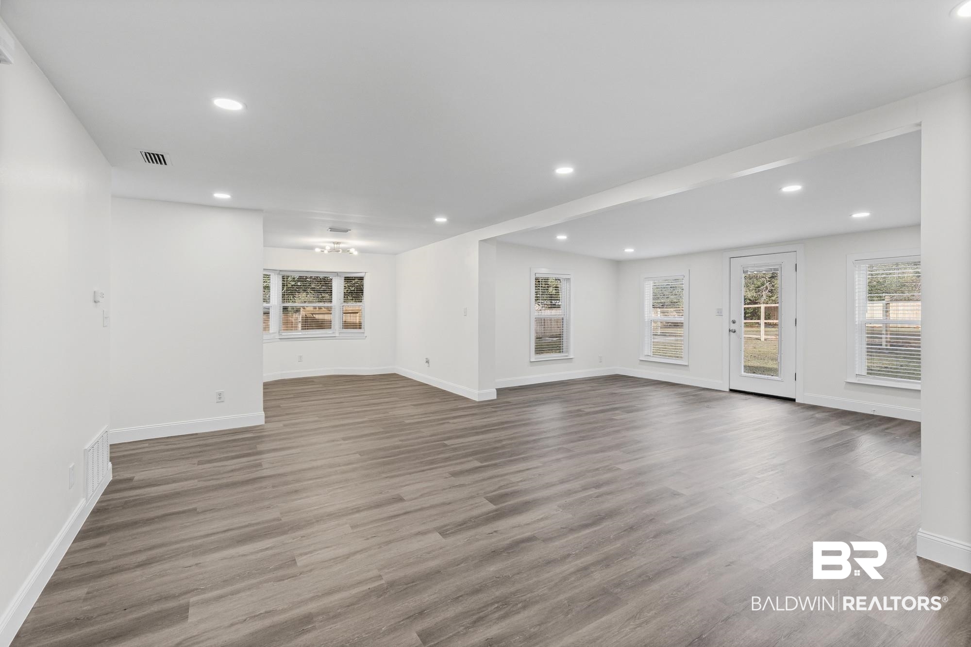 3041 Pretty Branch Drive East Mobile, AL 36618 - Photo 6 of 20 Unfurnished living room with recessed lighting and wood finished floors