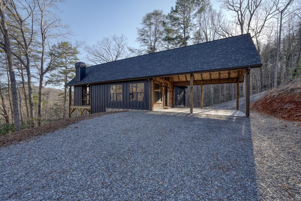 250 Wolfcreek Road Mineral Bluff, GA 30559 - Photo 14 of 59 a front view of house with a garden