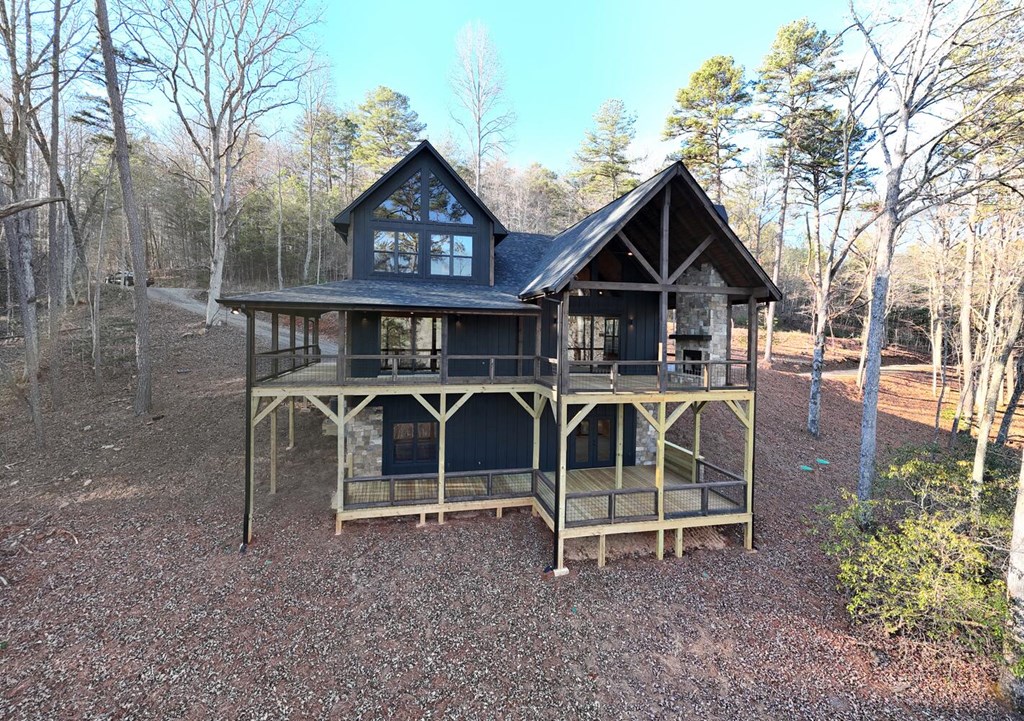 250 Wolfcreek Road Mineral Bluff, GA 30559 - Photo 21 of 59 a view of a house with wooden deck front of house