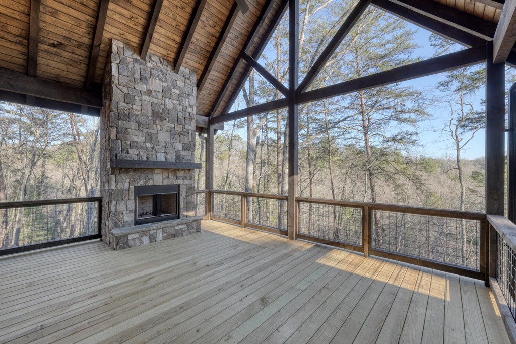 250 Wolfcreek Road Mineral Bluff, GA 30559 - Photo 28 of 59 a view of empty room with wooden floor and fireplace