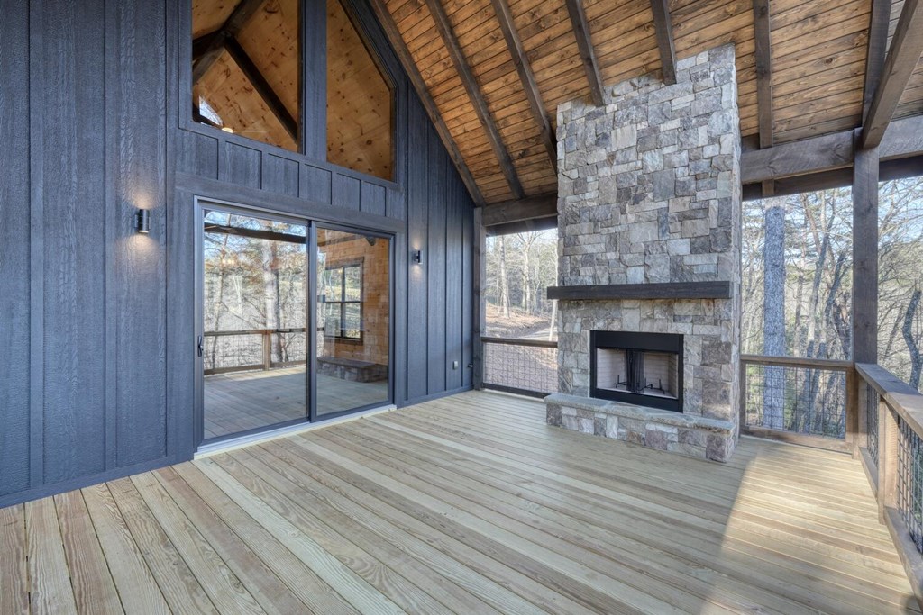 250 Wolfcreek Road Mineral Bluff, GA 30559 - Photo 29 of 59 a view of an empty room with wooden floor fireplace and a window