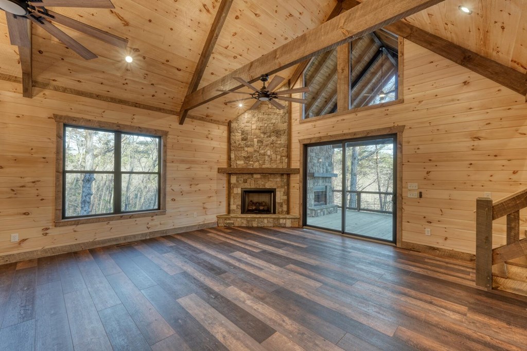250 Wolfcreek Road Mineral Bluff, GA 30559 - Photo 30 of 59 a view of an empty room with wooden floor and a window