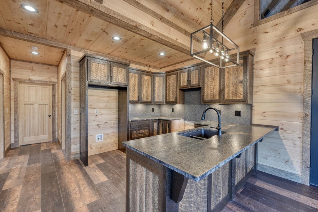 250 Wolfcreek Road Mineral Bluff, GA 30559 - Photo 33 of 59 a kitchen with stainless steel appliances granite countertop a sink a refrigerator and a stove top oven