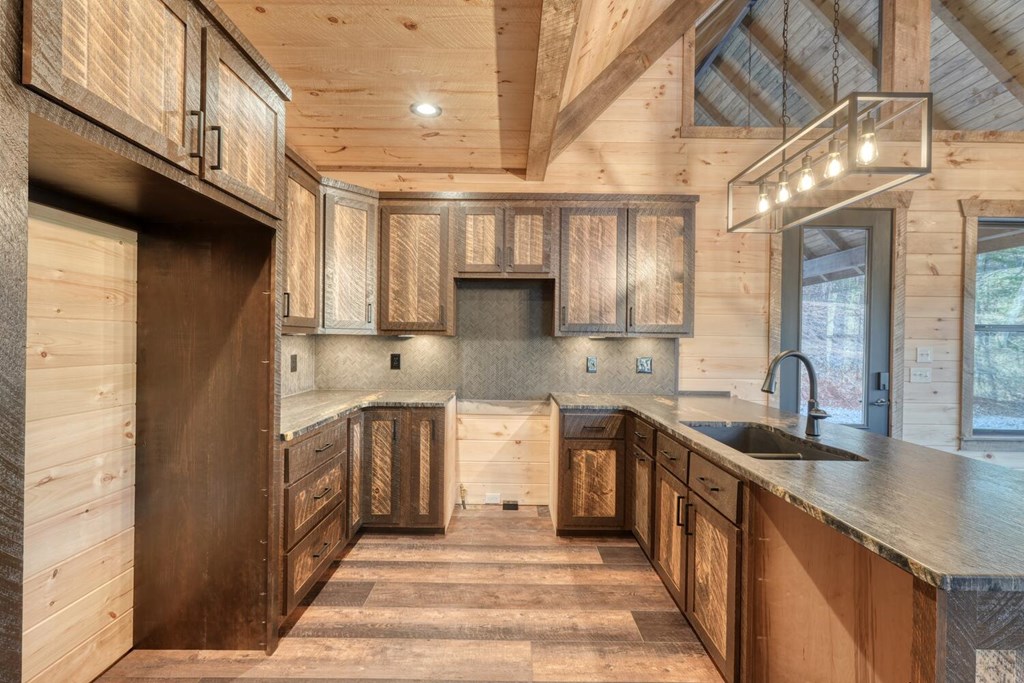 250 Wolfcreek Road Mineral Bluff, GA 30559 - Photo 34 of 59 a kitchen with stainless steel appliances granite countertop a sink a stove and a refrigerator