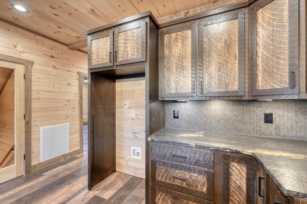 250 Wolfcreek Road Mineral Bluff, GA 30559 - Photo 37 of 59 a kitchen with stainless steel appliances granite countertop white cabinets and window