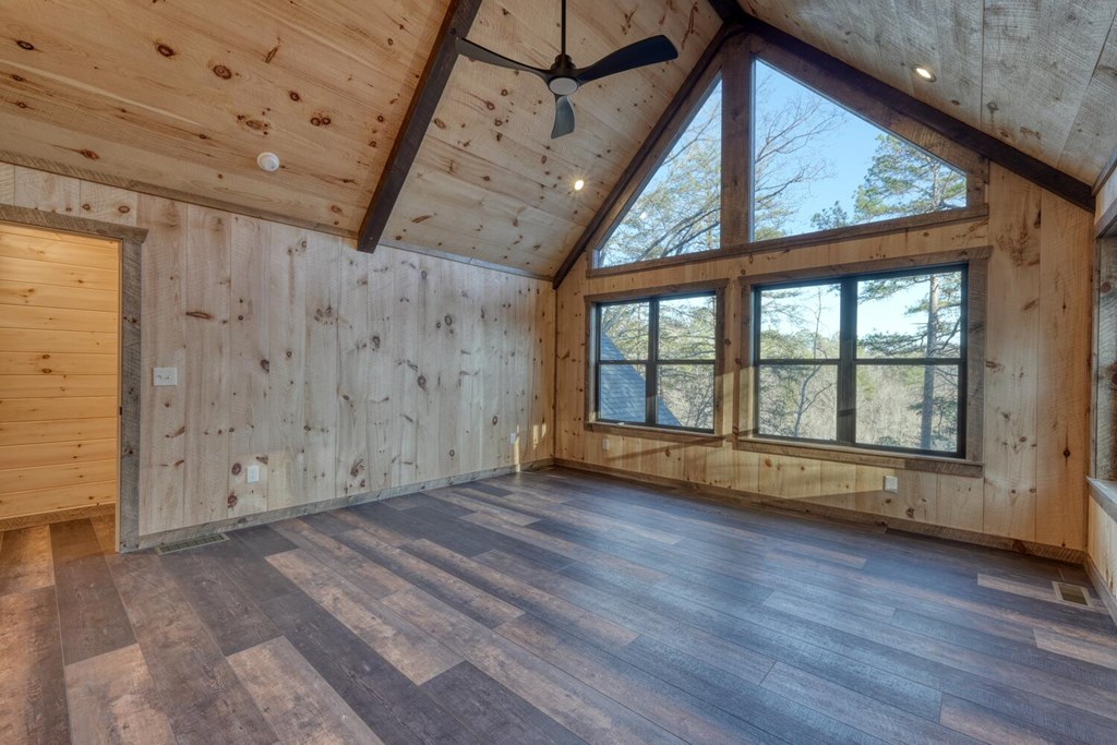 250 Wolfcreek Road Mineral Bluff, GA 30559 - Photo 42 of 59 a view of an empty room with wooden floor and a window