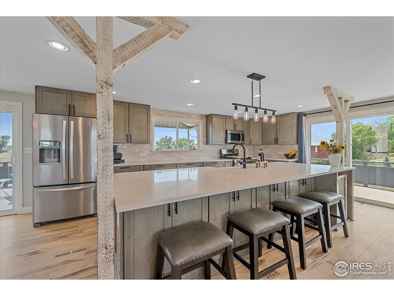 11724 Kenosha Road Longmont, CO 80504 - Photo 12 of 49 12 foot island with custom built cabinets in the front and back