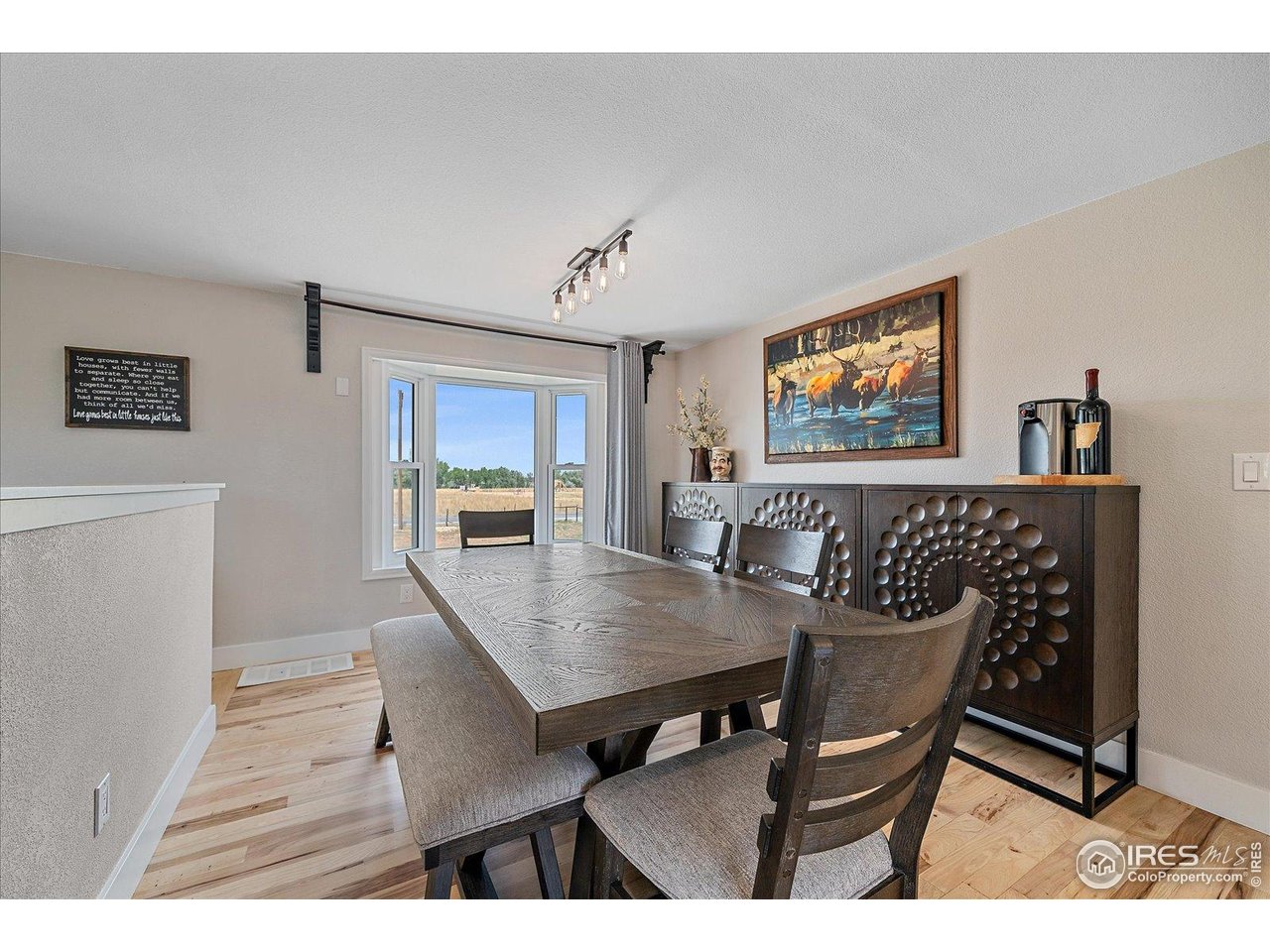 11724 Kenosha Road Longmont, CO 80504 - Photo 18 of 49 Dining room with bay window & bench