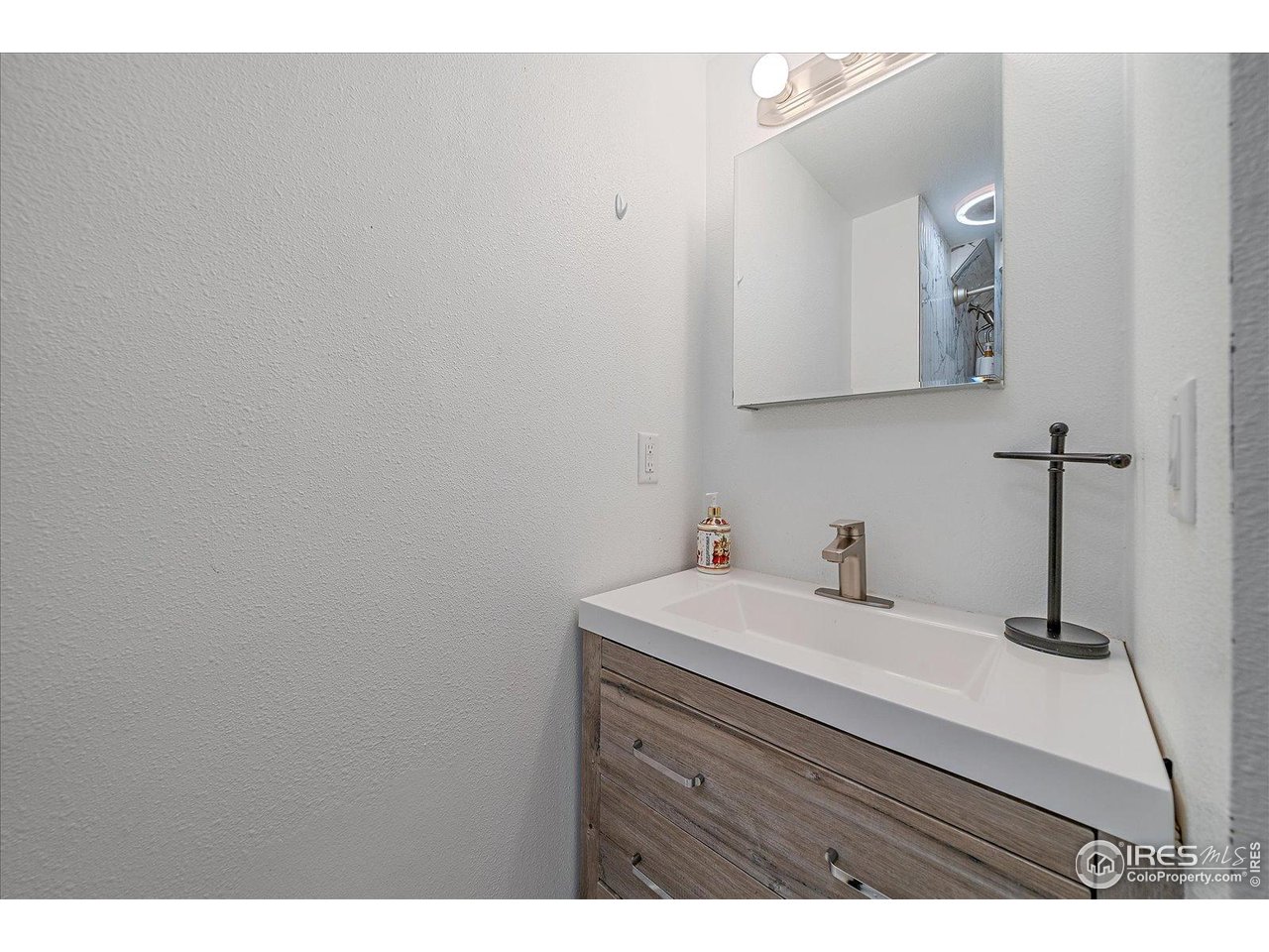 11724 Kenosha Road Longmont, CO 80504 - Photo 32 of 49 Lower level full bath sink area