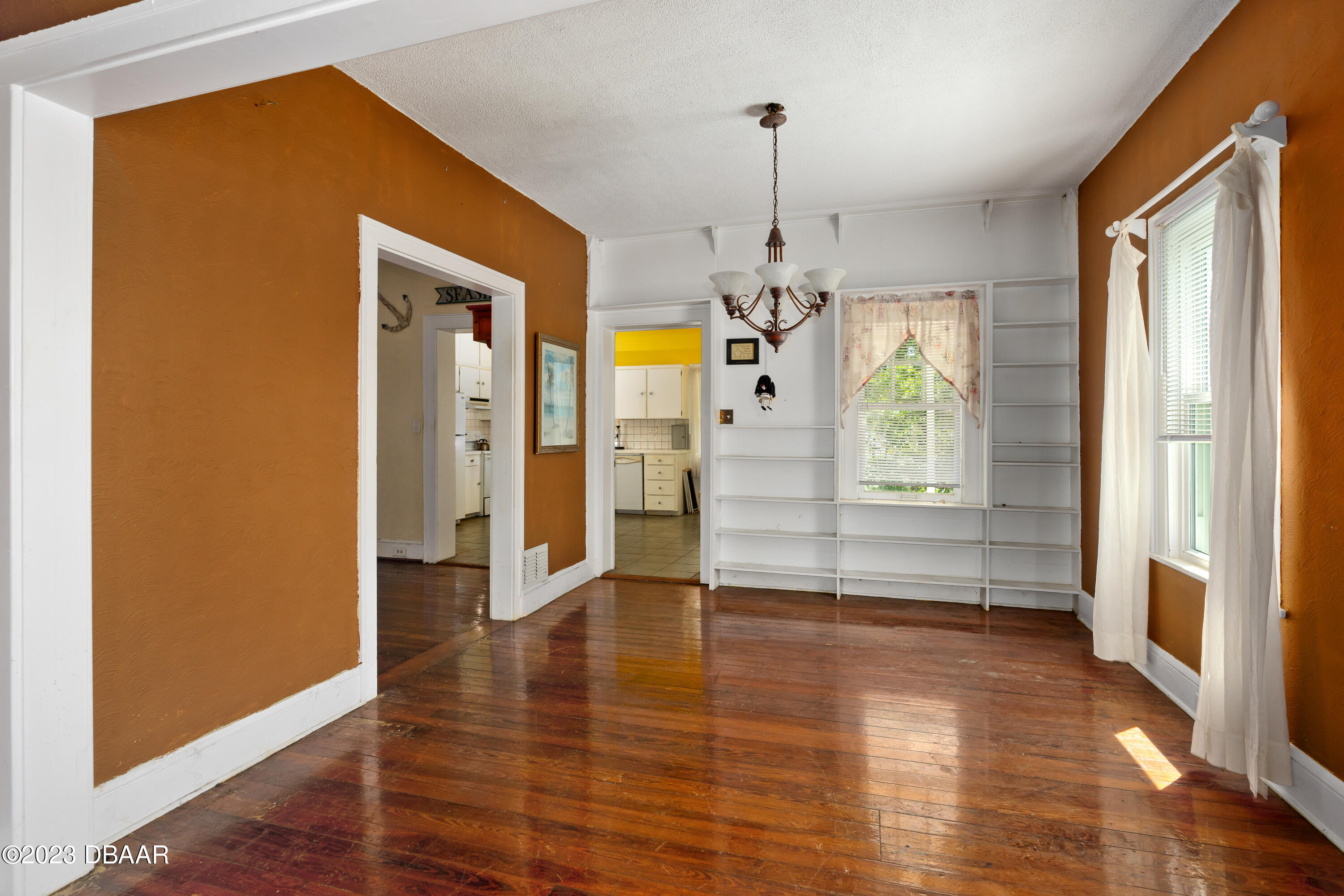 75 Seminole Avenue Ormond Beach, FL 32176 - Photo 16 of 59 a view of empty room with wooden floor and window