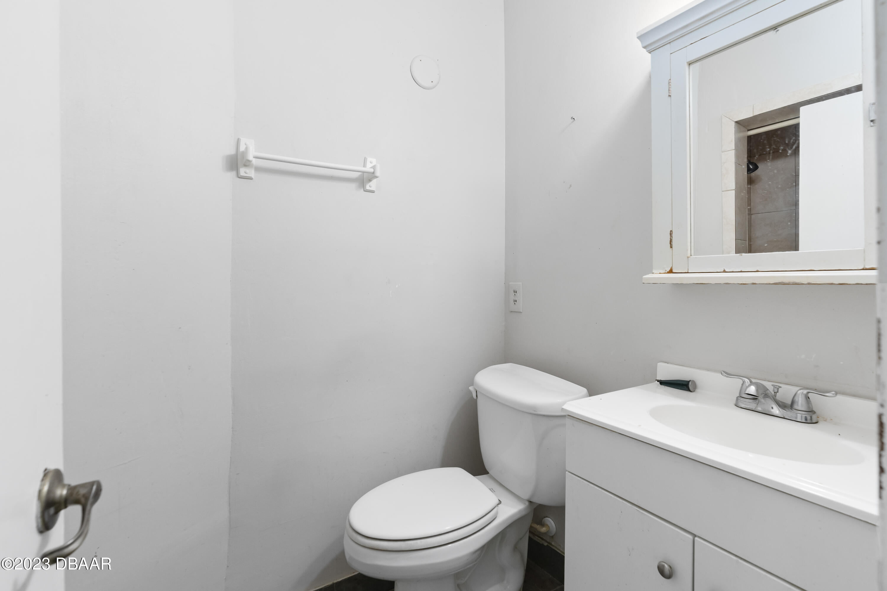 75 Seminole Avenue Ormond Beach, FL 32176 - Photo 43 of 59 a white toilet sitting next to a bathroom sink