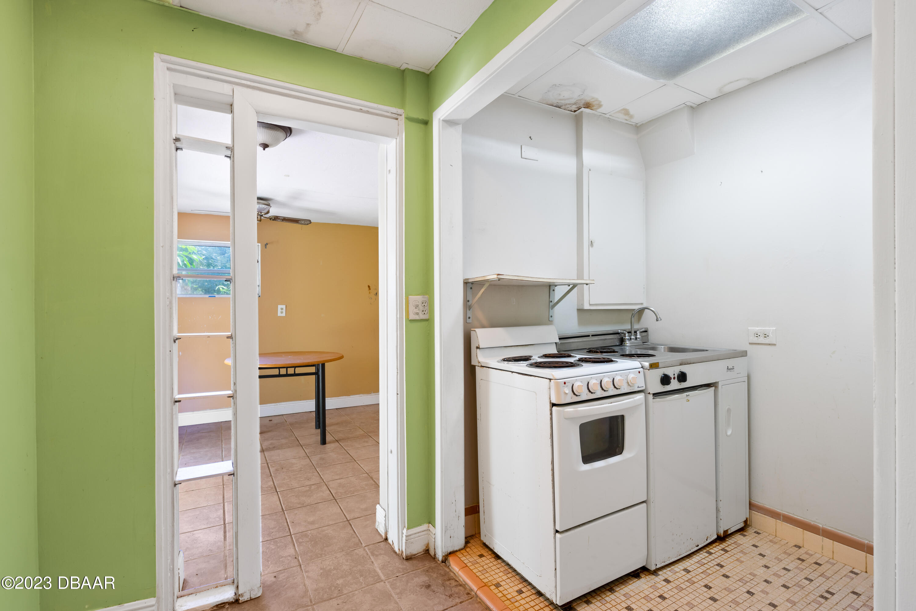 75 Seminole Avenue Ormond Beach, FL 32176 - Photo 46 of 59 a kitchen with a stove and a wooden floors