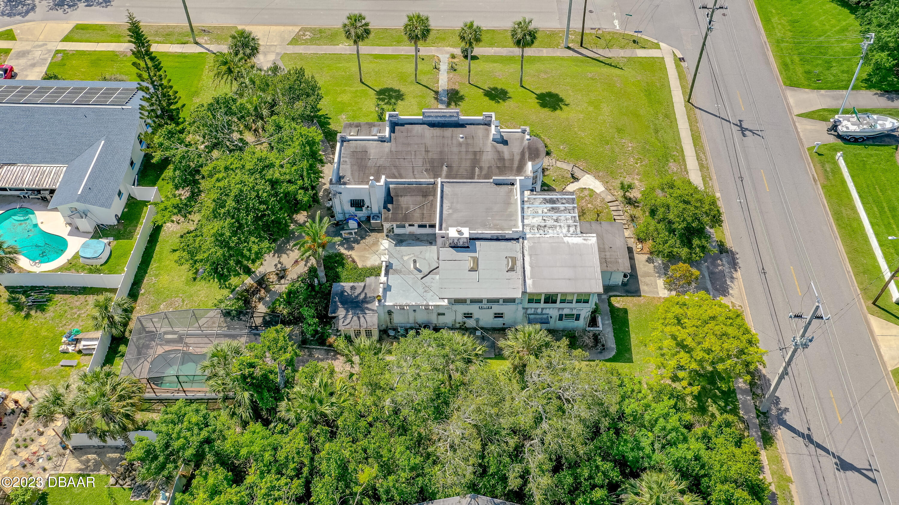 75 Seminole Avenue Ormond Beach, FL 32176 - Photo 51 of 59 an aerial view of a house with swimming pool and large trees