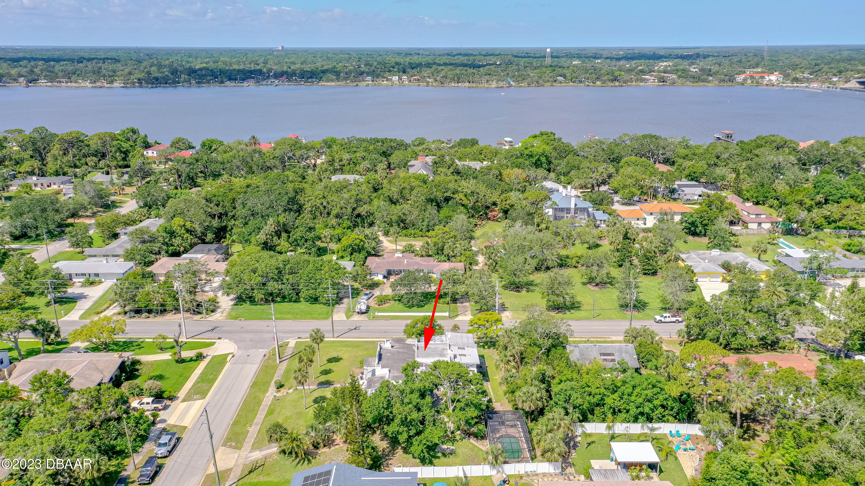 75 Seminole Avenue Ormond Beach, FL 32176 - Photo 56 of 59 an aerial view of a houses with a lake