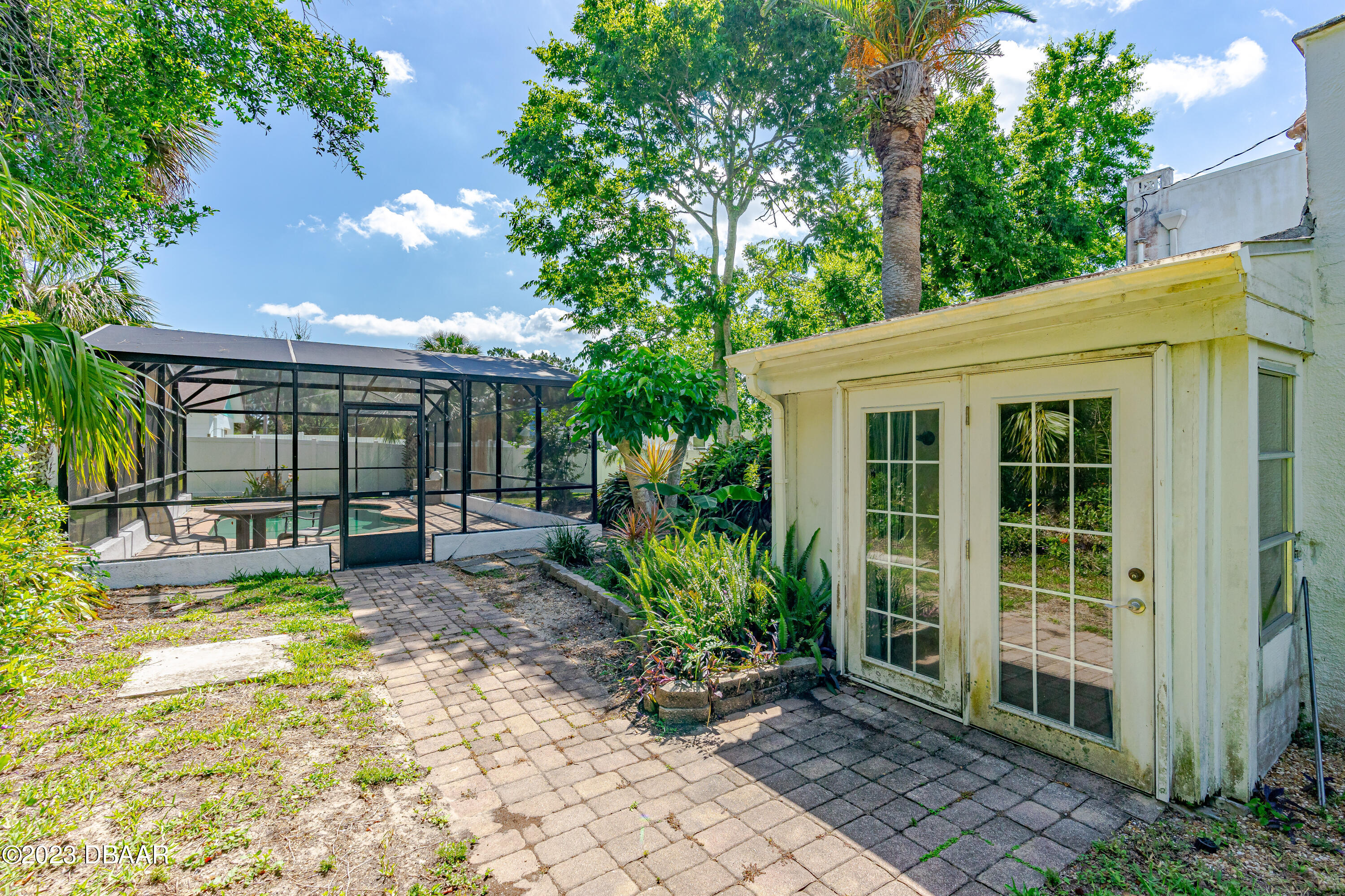 75 Seminole Avenue Ormond Beach, FL 32176 - Photo 7 of 59 a view of a house with sitting area and garden