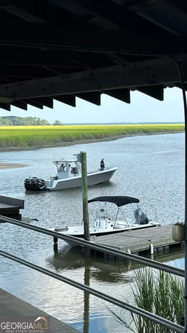 a view of a lake with outdoor seating space