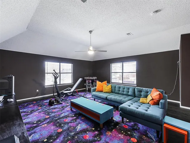 a living room with furniture rug and window